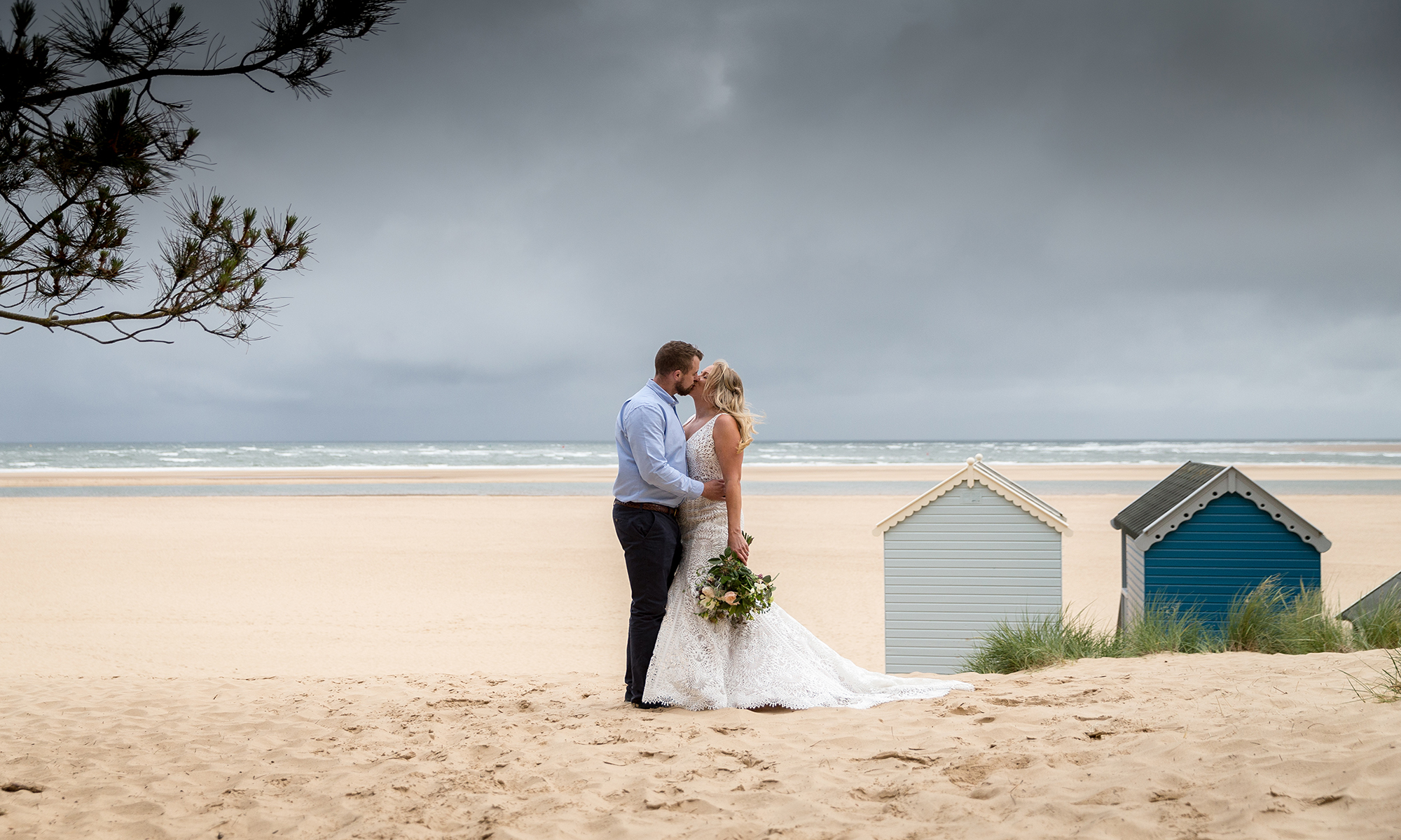 Newly Married couple kissing on a beach